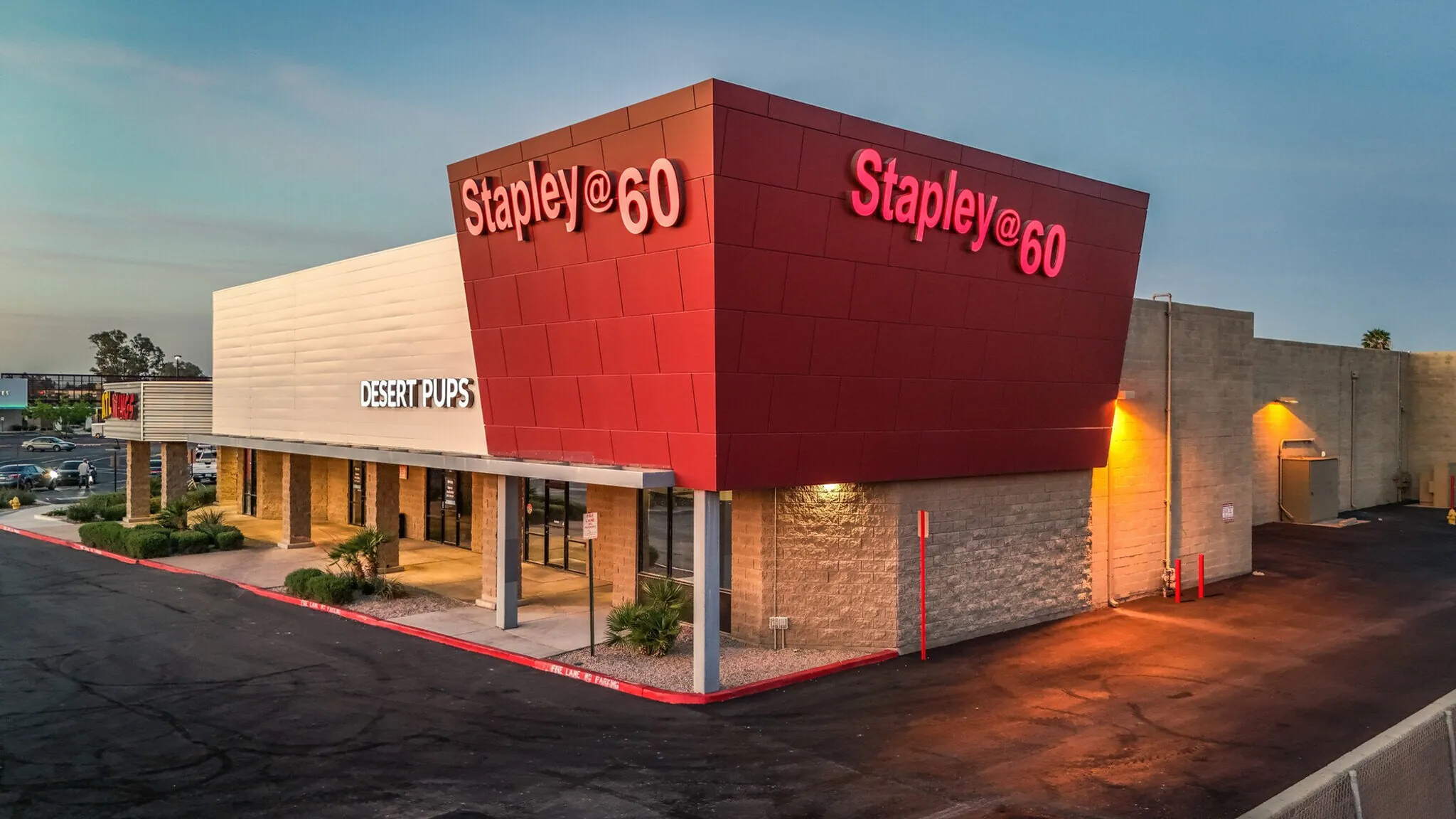 Stapley @ 60 shopping center at dusk after its full facelift, with the red Stapley @ 60 tower sign lit